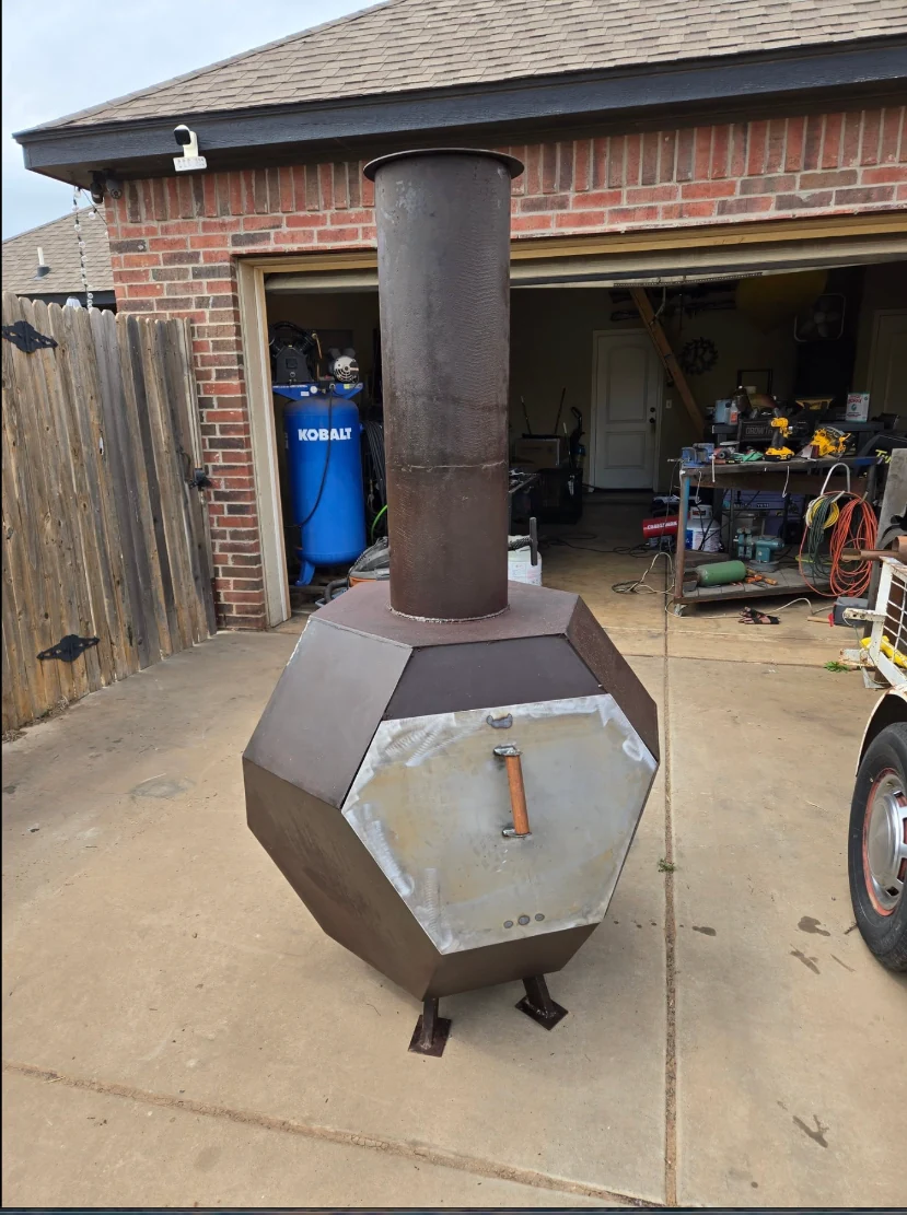 Large custom chimney fire pit pictured outside the workshop